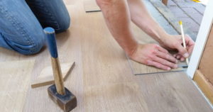 man measuring a floor 01